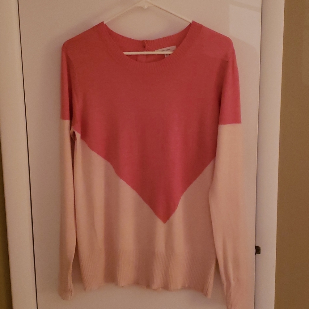 Pale orange and cream sweater